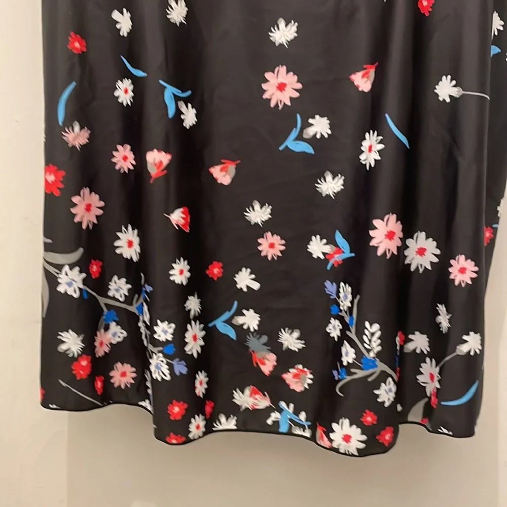 - New Woman’s swim tank black and floral size L adjustable